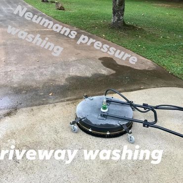Professional driveway pressure washing in progress. Carrollton GA