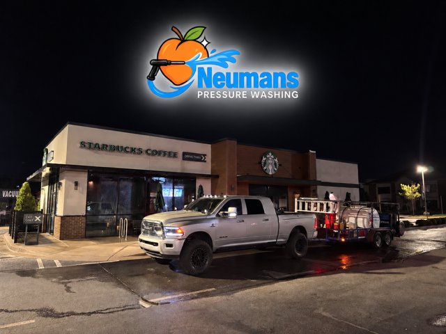 Neuman’s Pressure Washing truck and equipment outside a Starbucks location at night in Carrollton, Georgia